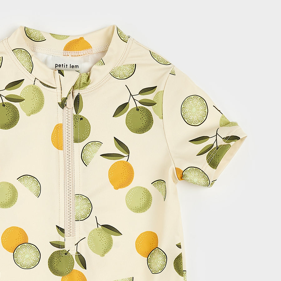 Citrus Print on Antique White Swim Romper by Petit Lem