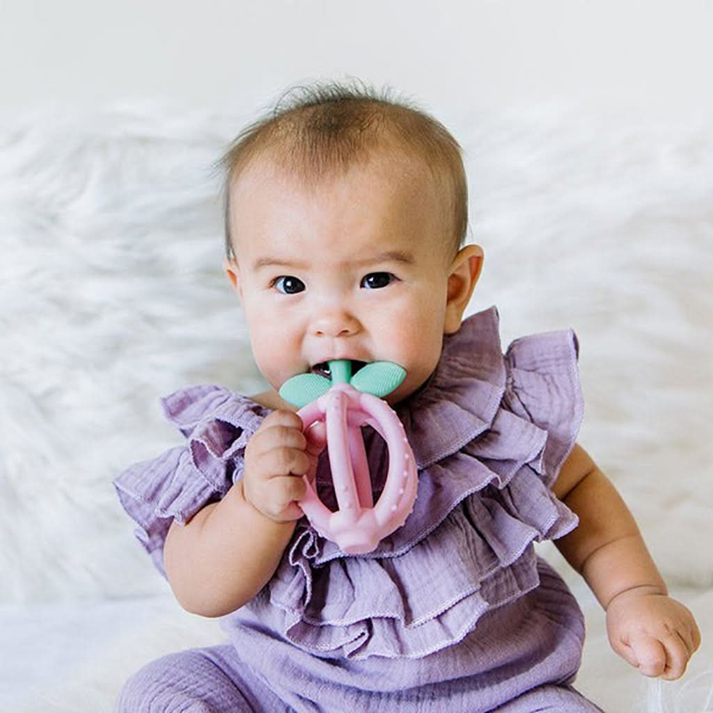 Bitzy Biter™ Teething Ball- Pink Lemonade by Itzy Ritzy
