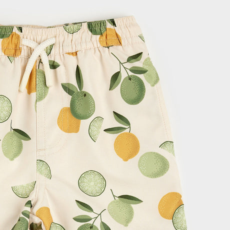 Citrus Print on Antique White Swim Trunks by Petit Lem