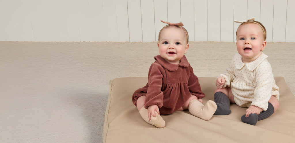 Two Babies Smiling