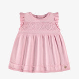 Pale pink knitted dress with openwork flower detail by Souris Mini