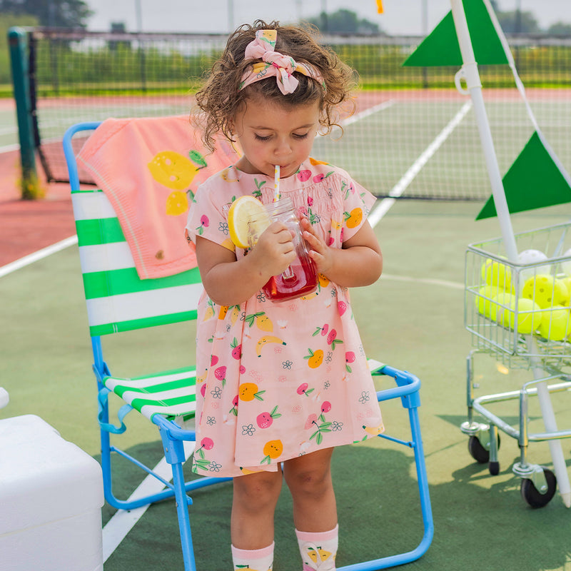 Pink dress in viscose with fruit all over print by Souris Mini