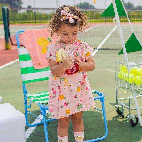 Pink dress in viscose with fruit all over print by Souris Mini